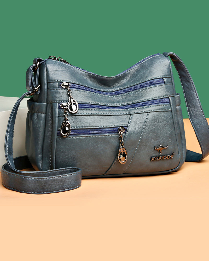 Multi-pocket soft leather crossbody bag